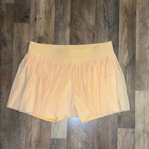 Lululemon light tangerine colored Pleated Skirt size 12